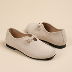 Beige loafers flatlay