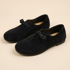Black loafers flatlay