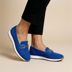 Blue loafers on feet