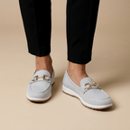 White loafers on feet
